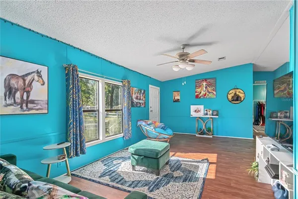 a living room with furniture and a large window