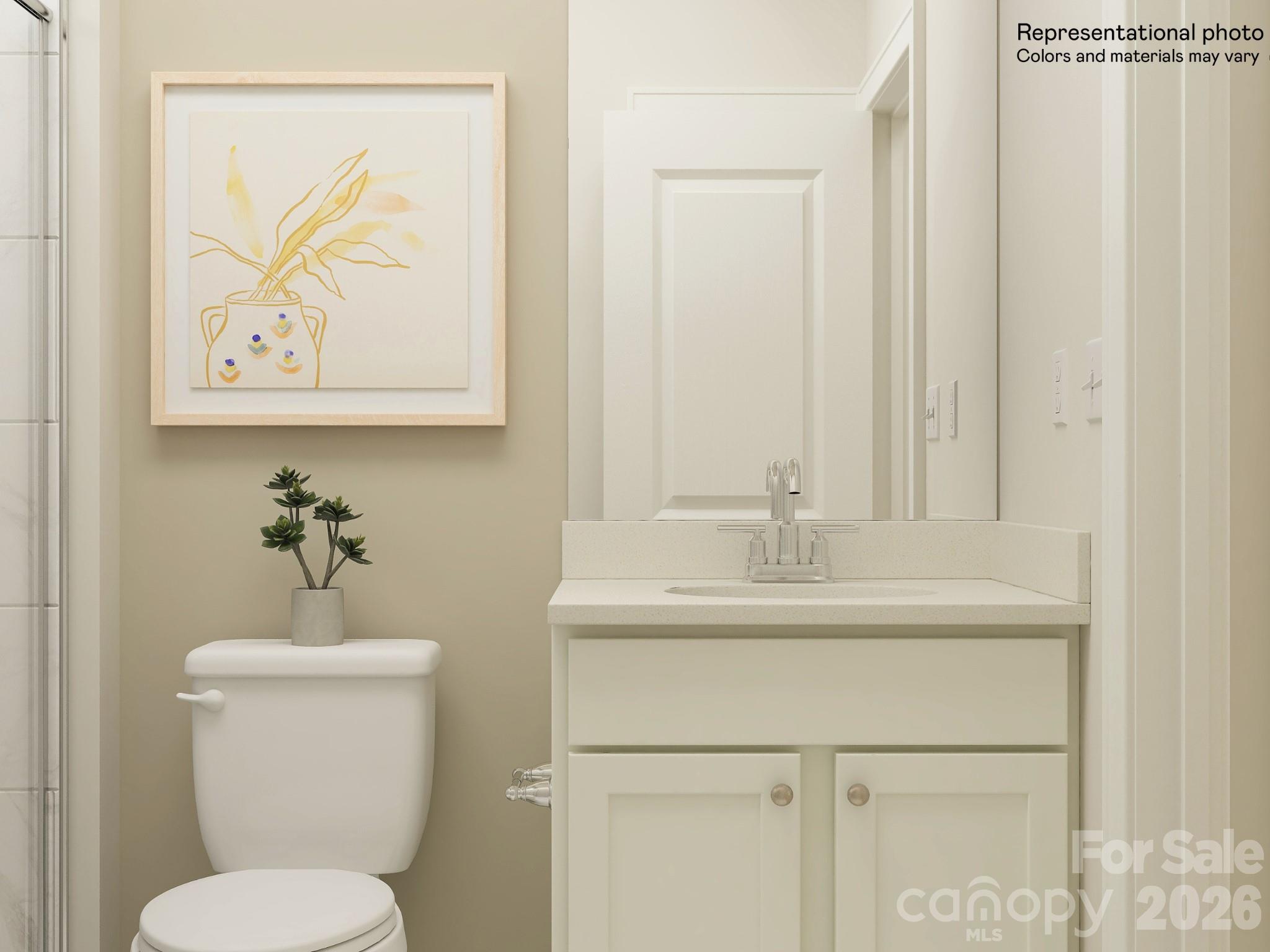 5434 Redbud Road, Unit 69 Lancaster, SC 29720 - Photo 8 of 18 a bathroom with a toilet a sink and mirror