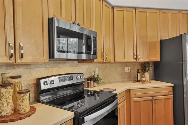 a kitchen with a stove and a microwave