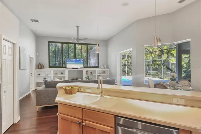 a kitchen with a sink and a large window