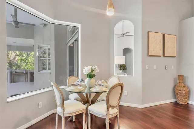 a view of a dining room with furniture and wooden floor