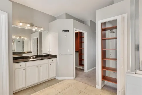 a large kitchen with cabinets and a sink