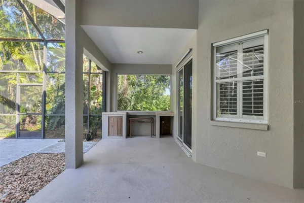 a view of balcony with furniture and garden