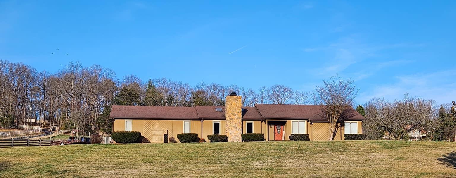 346 Foxcroft Drive Blue Ridge, VA 24064 - Photo 3 of 42 a front view of a house with a yard
