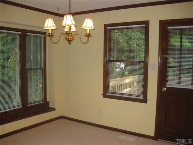 5526 Hamstead Crossing Raleigh, NC 27612 - Photo 20 of 24 a view of a room with a window and chandelier