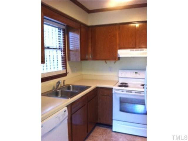 5526 Hamstead Crossing Raleigh, NC 27612 - Photo 5 of 24 a kitchen with a sink and a window