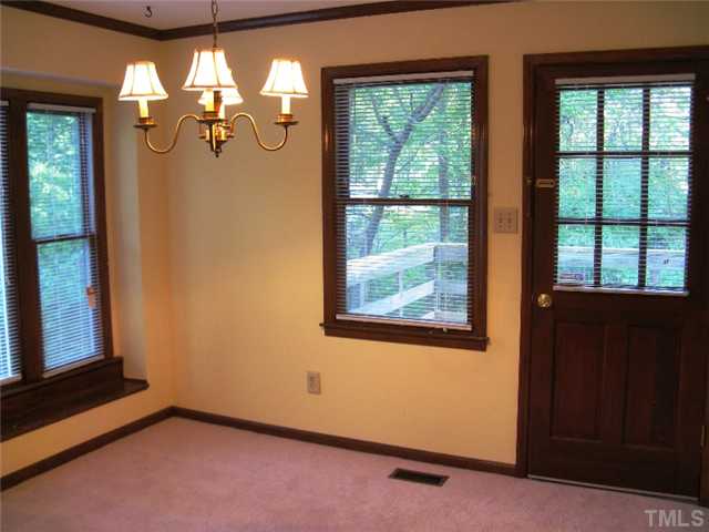 5526 Hamstead Crossing Raleigh, NC 27612 - Photo 6 of 24 a view of a room with windows and chandelier