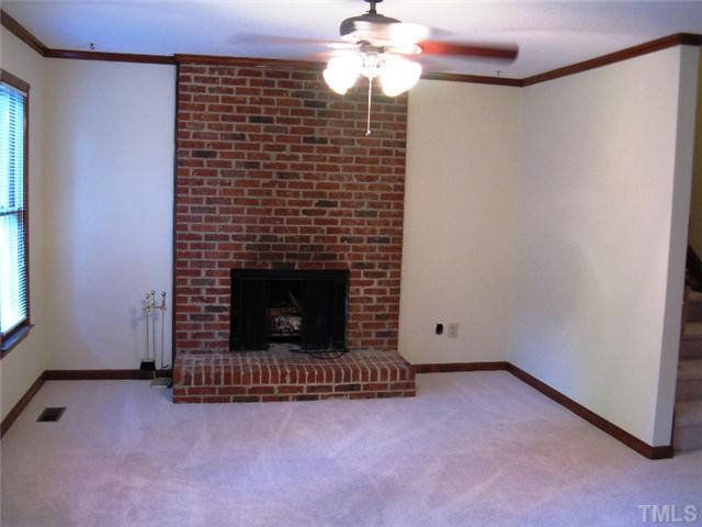 5526 Hamstead Crossing Raleigh, NC 27612 - Photo 9 of 24 a view of empty room with a fireplace