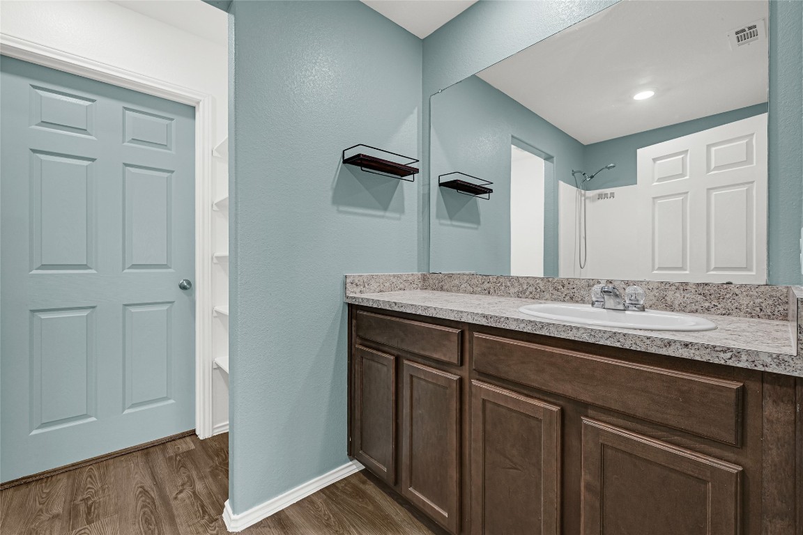 6020 Rimini Landing Lane Porter, TX 77365 - Photo 13 of 33 a bathroom with a sink and a mirror