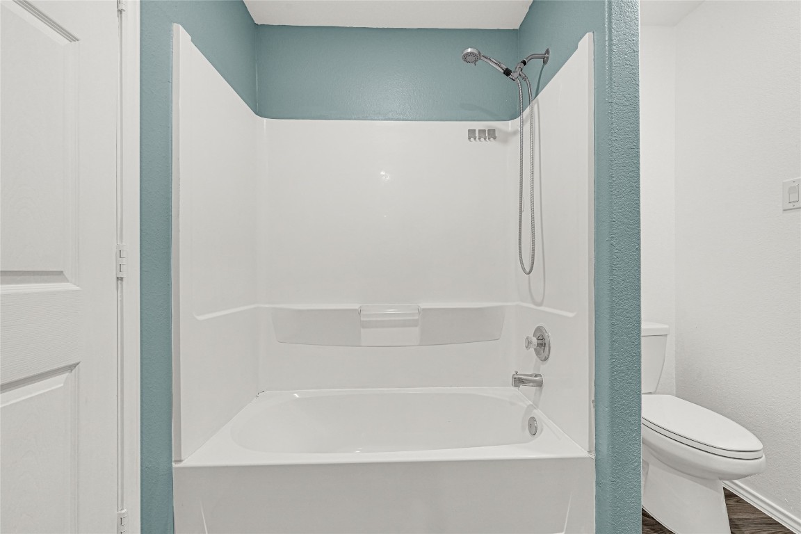 6020 Rimini Landing Lane Porter, TX 77365 - Photo 14 of 33 a bathroom with a bathtub and a toilet