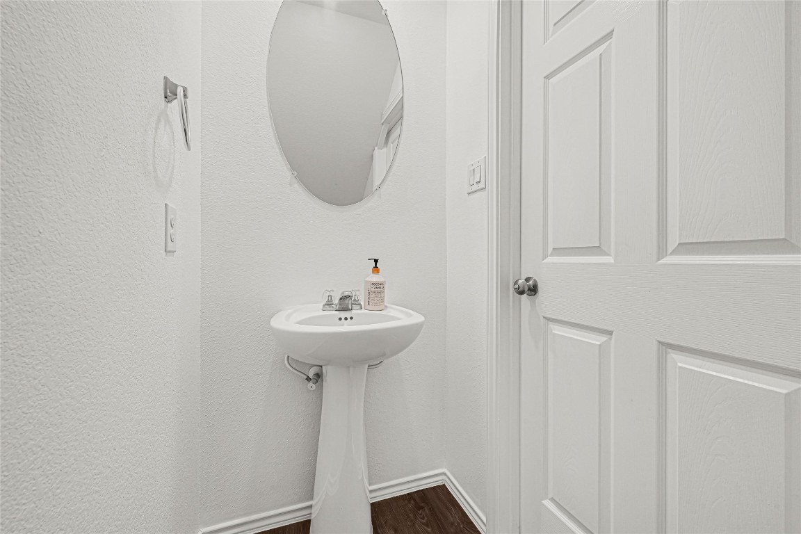 6020 Rimini Landing Lane Porter, TX 77365 - Photo 16 of 33 a bathroom with a sink and a mirror