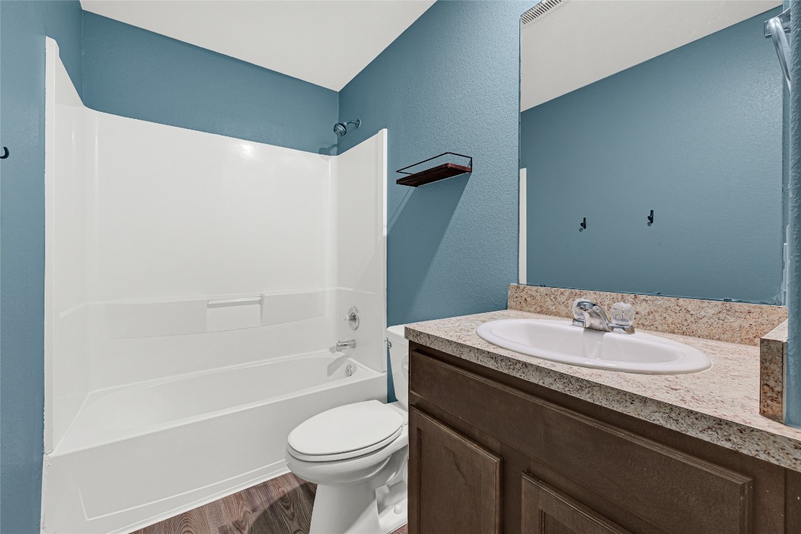 6020 Rimini Landing Lane Porter, TX 77365 - Photo 25 of 33 a bathroom with a sink a toilet and shower