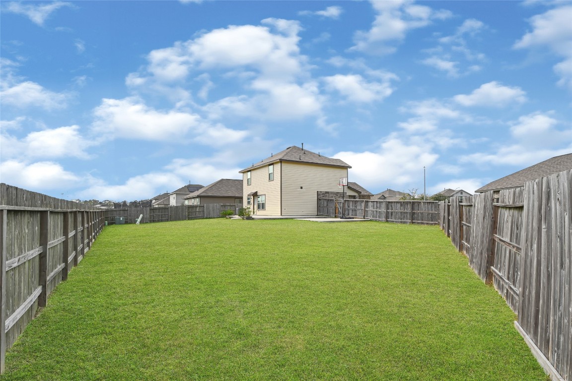 6020 Rimini Landing Lane Porter, TX 77365 - Photo 27 of 33 a view of a house with a big yard and a fountain