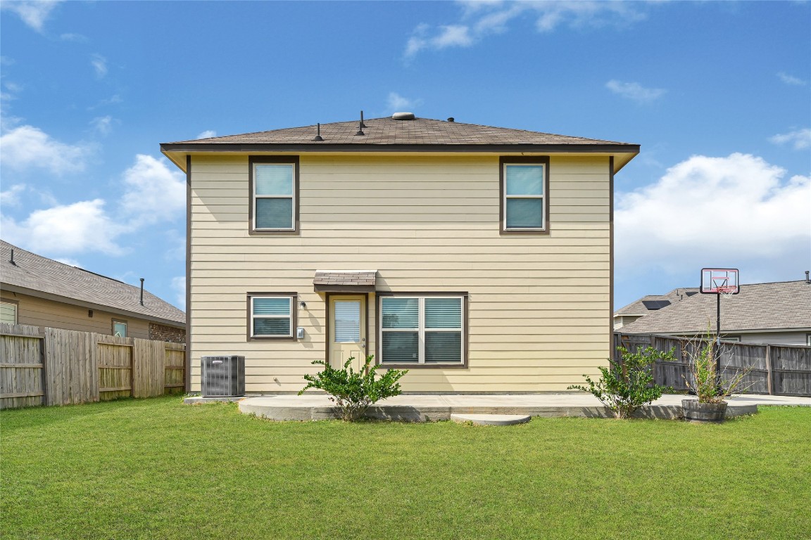 6020 Rimini Landing Lane Porter, TX 77365 - Photo 28 of 33 a view of a house with a yard