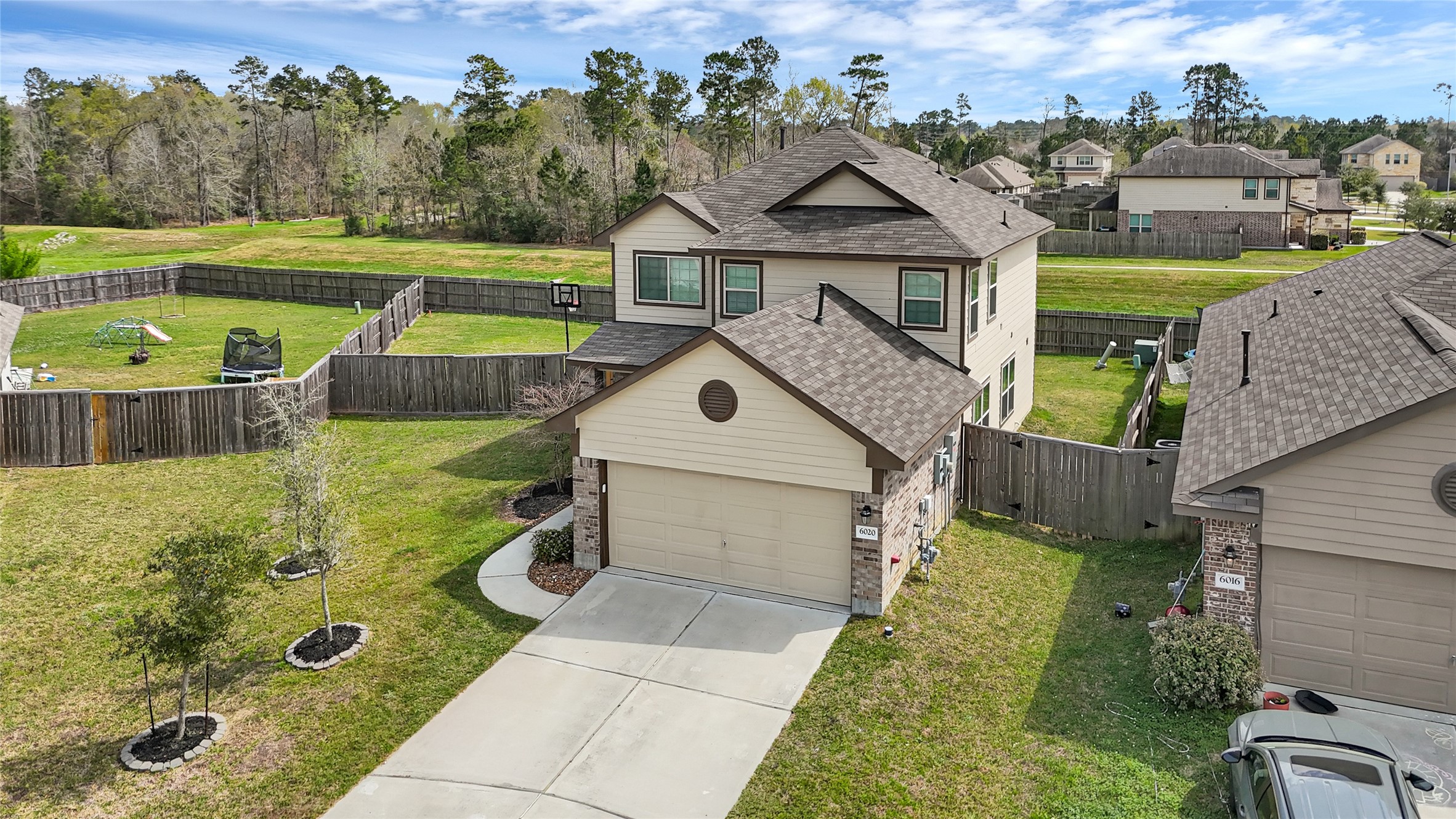 6020 Rimini Landing Lane Porter, TX 77365 - Photo 3 of 33 sitting on almost 10,000 sq ft with no rear neighbors