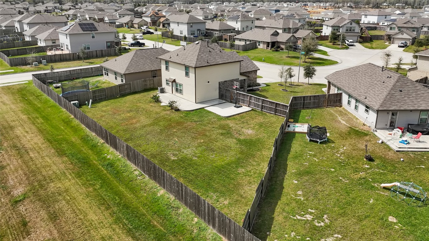 6020 Rimini Landing Lane Porter, TX 77365 - Photo 32 of 33 an aerial view of residential houses with outdoor space
