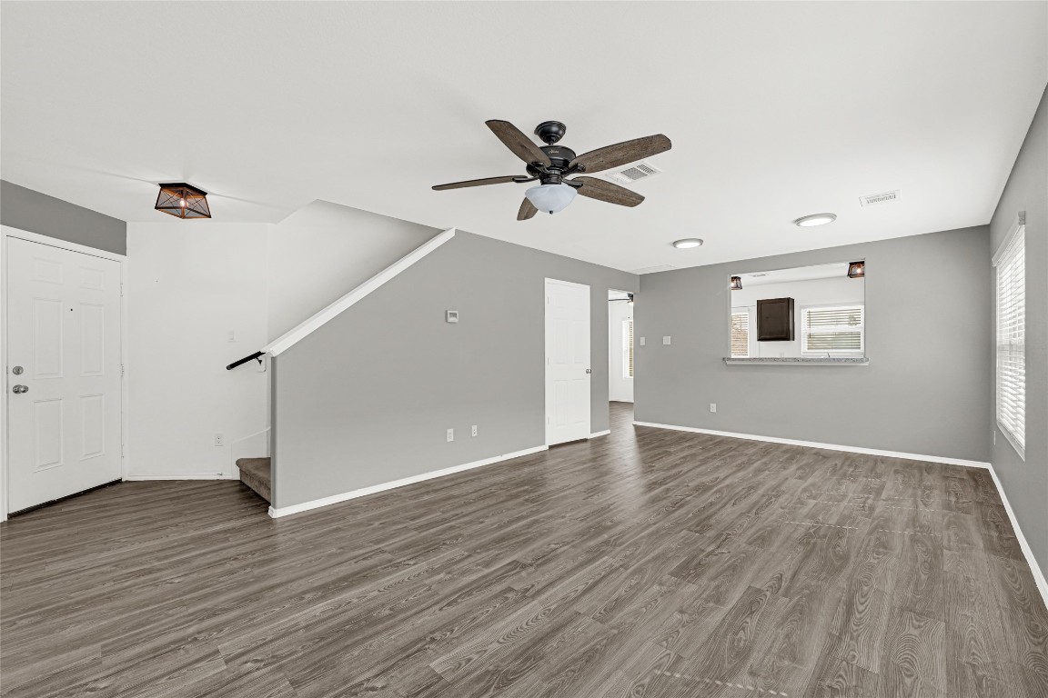 6020 Rimini Landing Lane Porter, TX 77365 - Photo 6 of 33 an empty room with wooden floor and windows