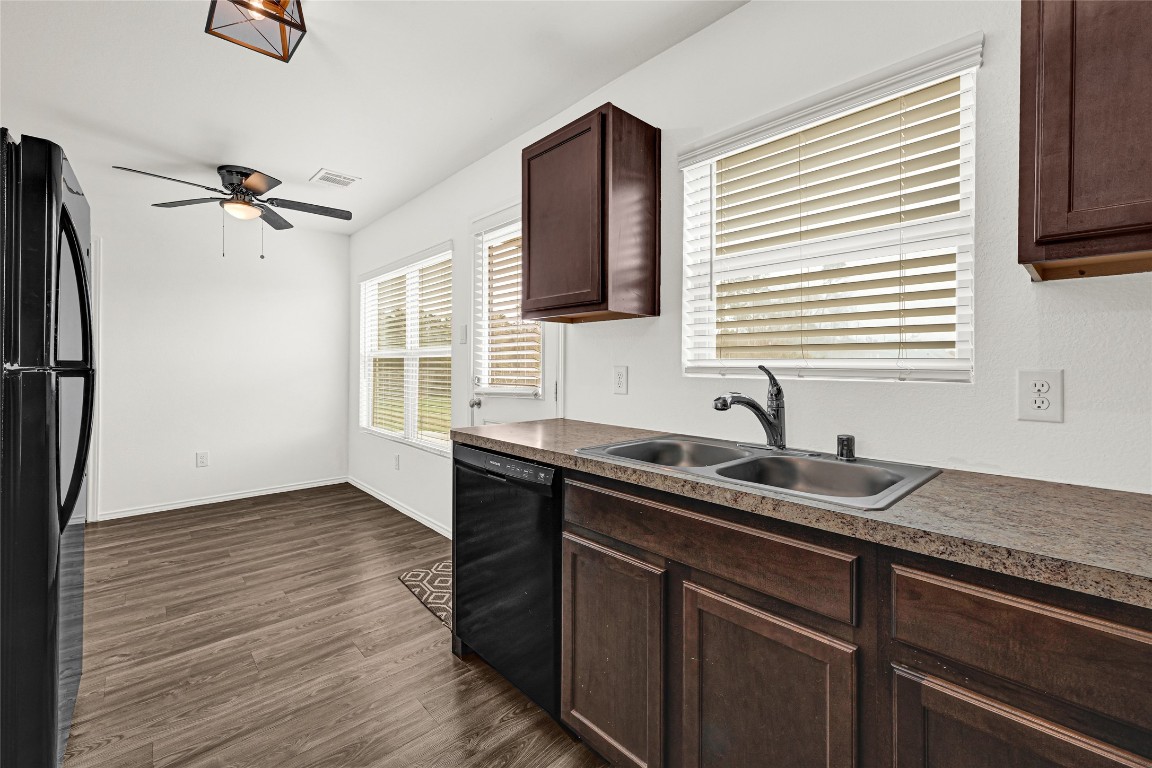 6020 Rimini Landing Lane Porter, TX 77365 - Photo 10 of 33 a kitchen with a sink and a refrigerator