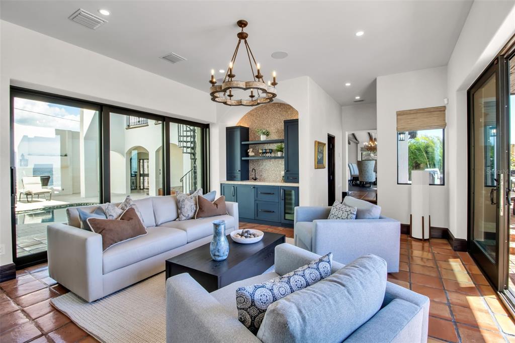 121 North Casey Key Road Osprey, FL 34229 - Photo 9 of 63 a living room with furniture ceiling fan and a rug