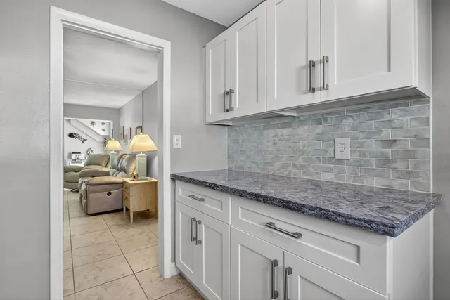 a kitchen with white cabinets