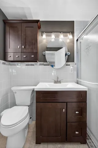 a bathroom with a sink vanity and mirror