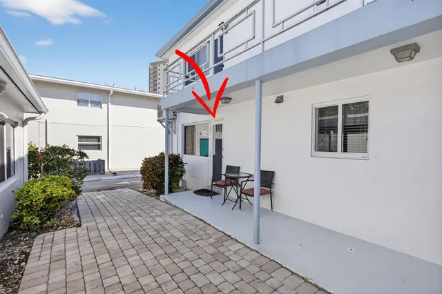 a view of a chairs and tables in patio