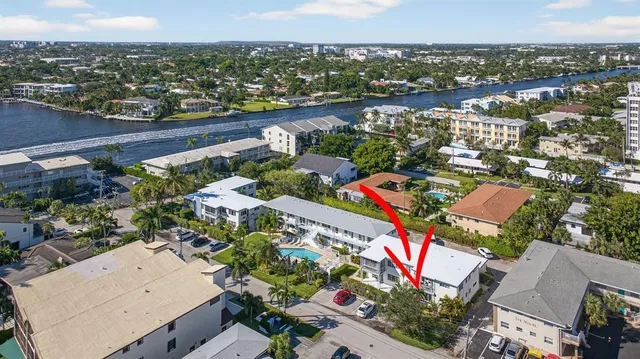 an aerial view of a house with a lake view