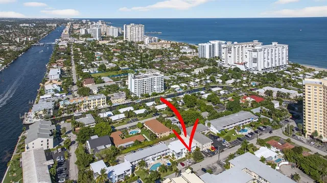 a street sign that is sitting in front of a building