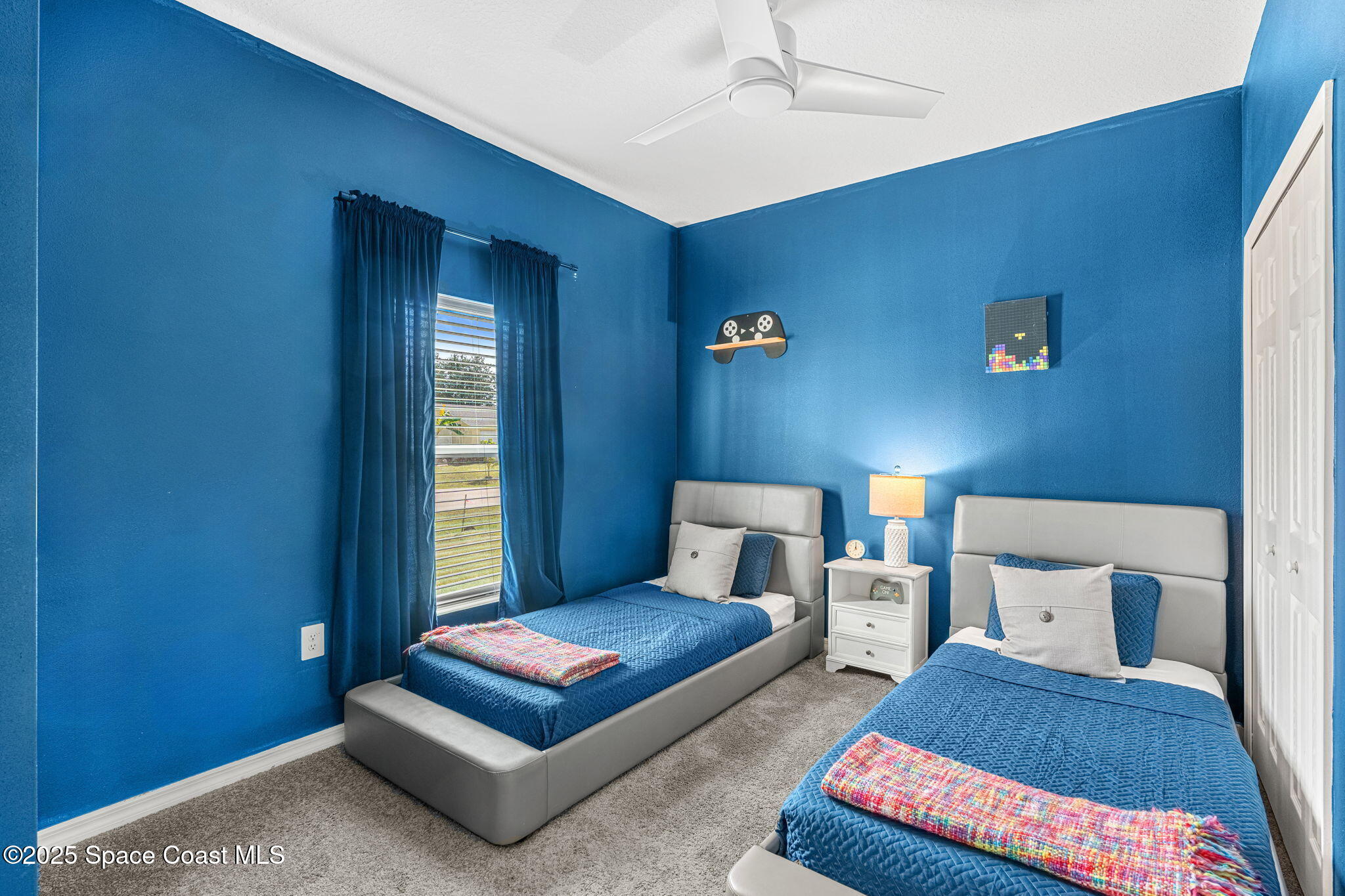 1125 Satin Road Palm Bay, FL 32908 - Photo 15 of 26 a bedroom with furniture and a rug