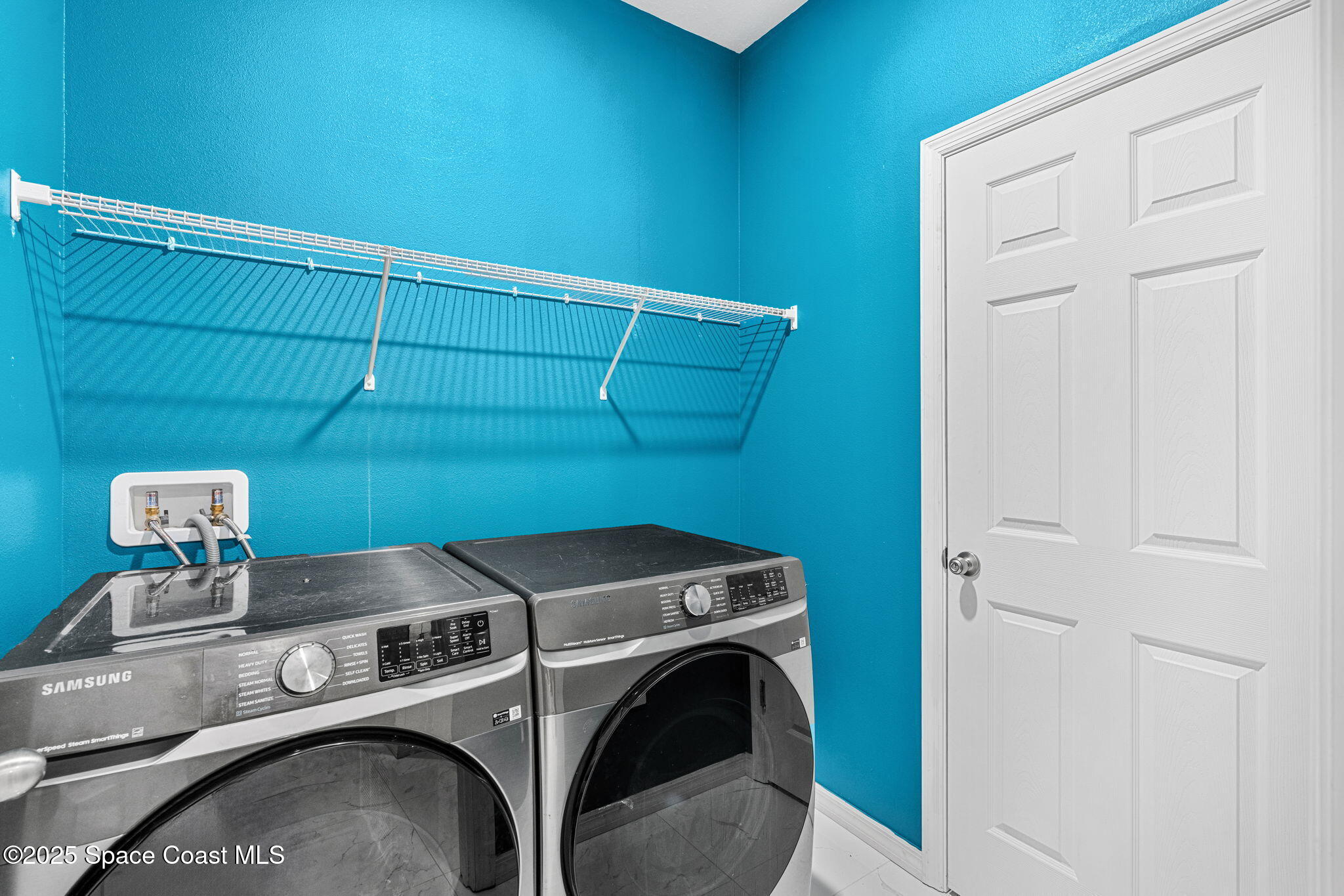 1125 Satin Road Palm Bay, FL 32908 - Photo 23 of 26 a utility room with dryer and washer