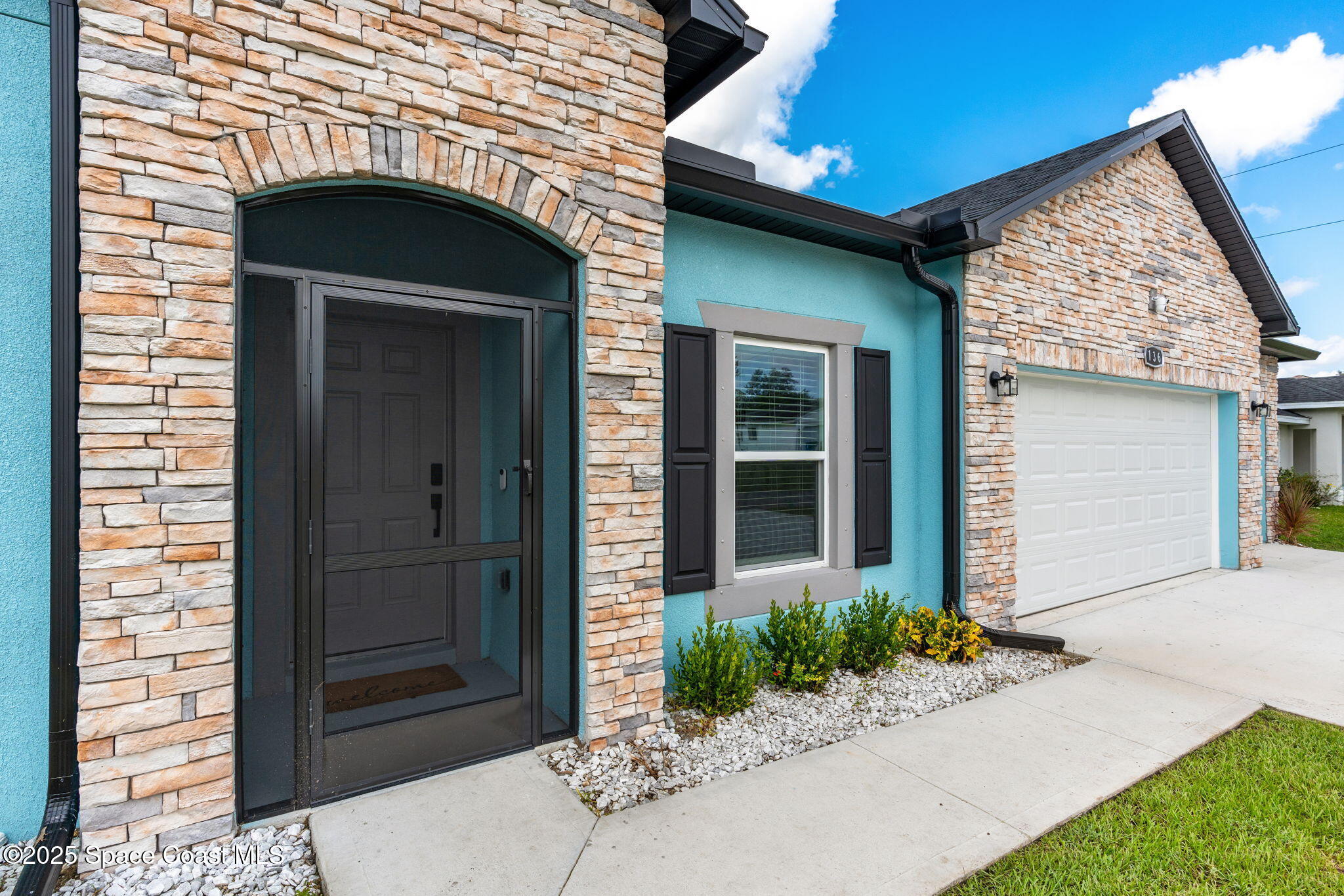 1125 Satin Road Palm Bay, FL 32908 - Photo 4 of 26 a front view of a house with a yard