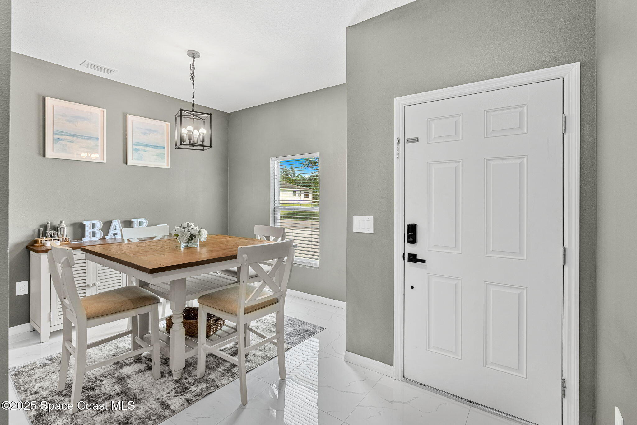 1125 Satin Road Palm Bay, FL 32908 - Photo 5 of 26 a dining room with furniture and window
