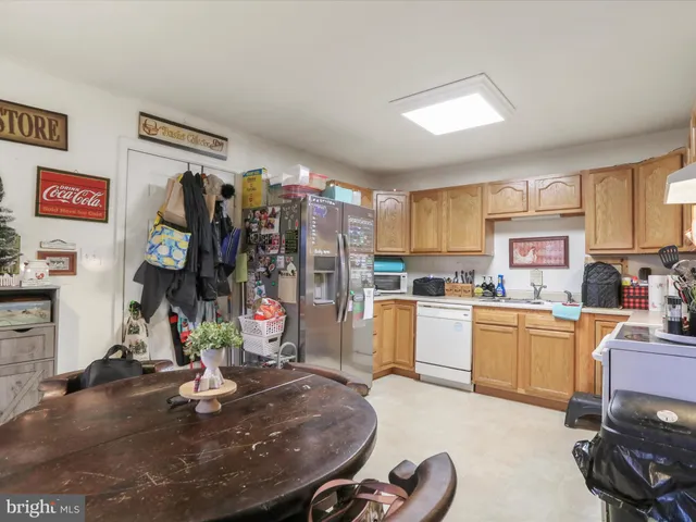 a living room filled with furniture and white walls