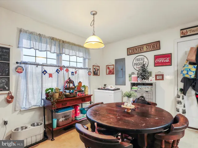 a dining room with furniture and window