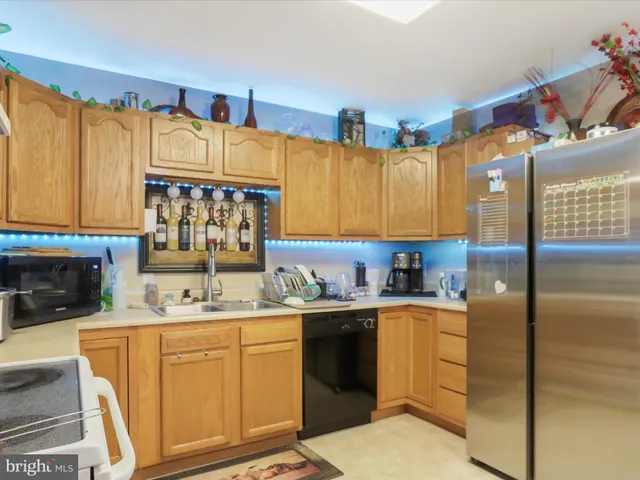 a kitchen with a sink cabinets and appliances