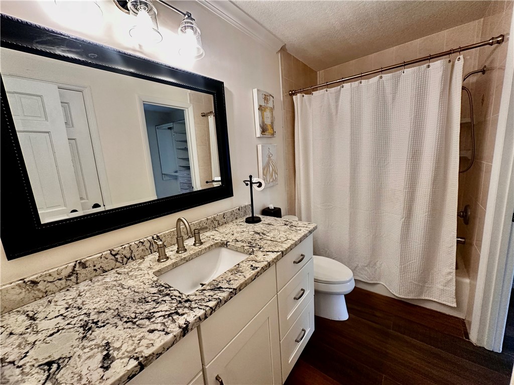 1815 Robalo Drive, Unit C201 Vero Beach, FL 32960 - Photo 12 of 31 a bathroom with a granite countertop sink and a mirror