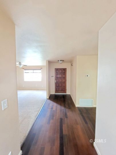 616 South Appaloosa Street Ridgecrest, CA 93555 - Photo 5 of 18 an empty room with wooden floor and windows
