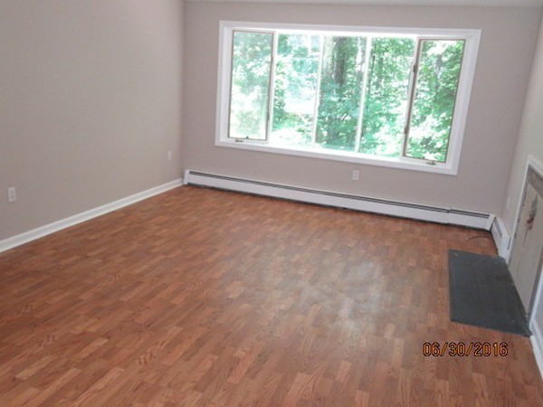 147 Flint Road Charlton, MA 01507 - Photo 8 of 29 an empty room with a window