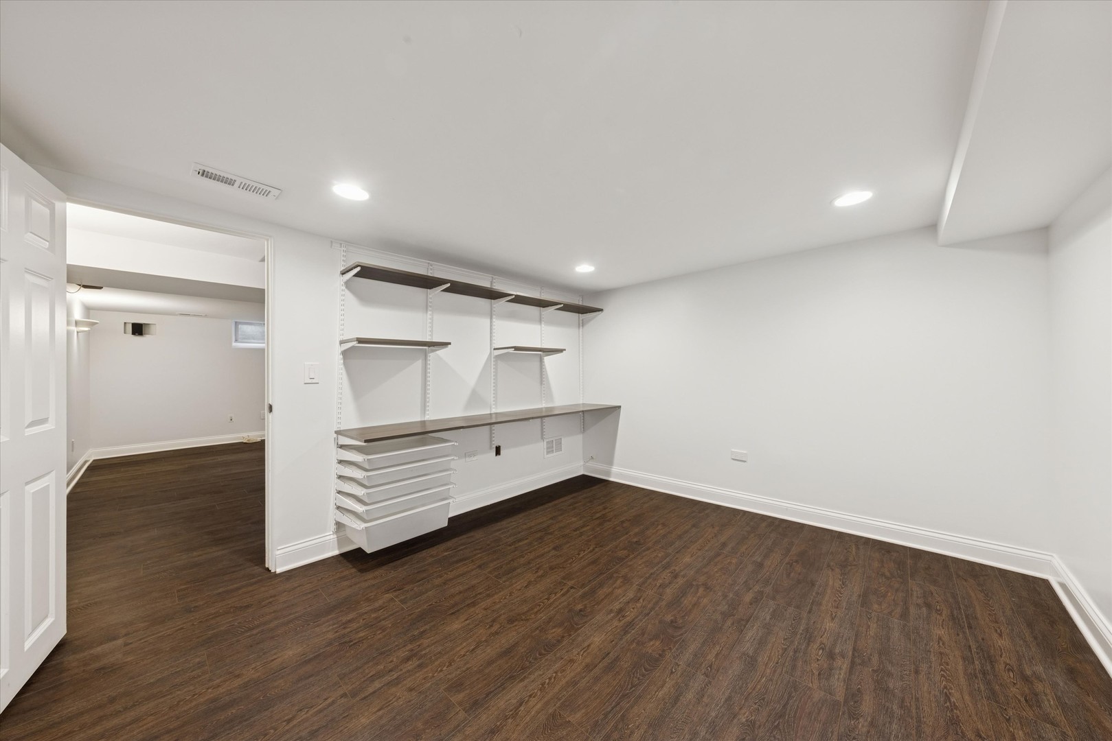 561 North County Line Road Hinsdale, IL 60521 - Photo 23 of 30 a view of an empty room with wooden floor and a window