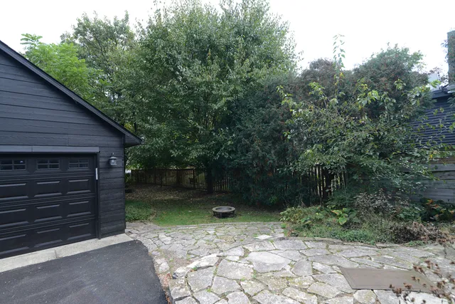 a backyard of a house with lots of green space