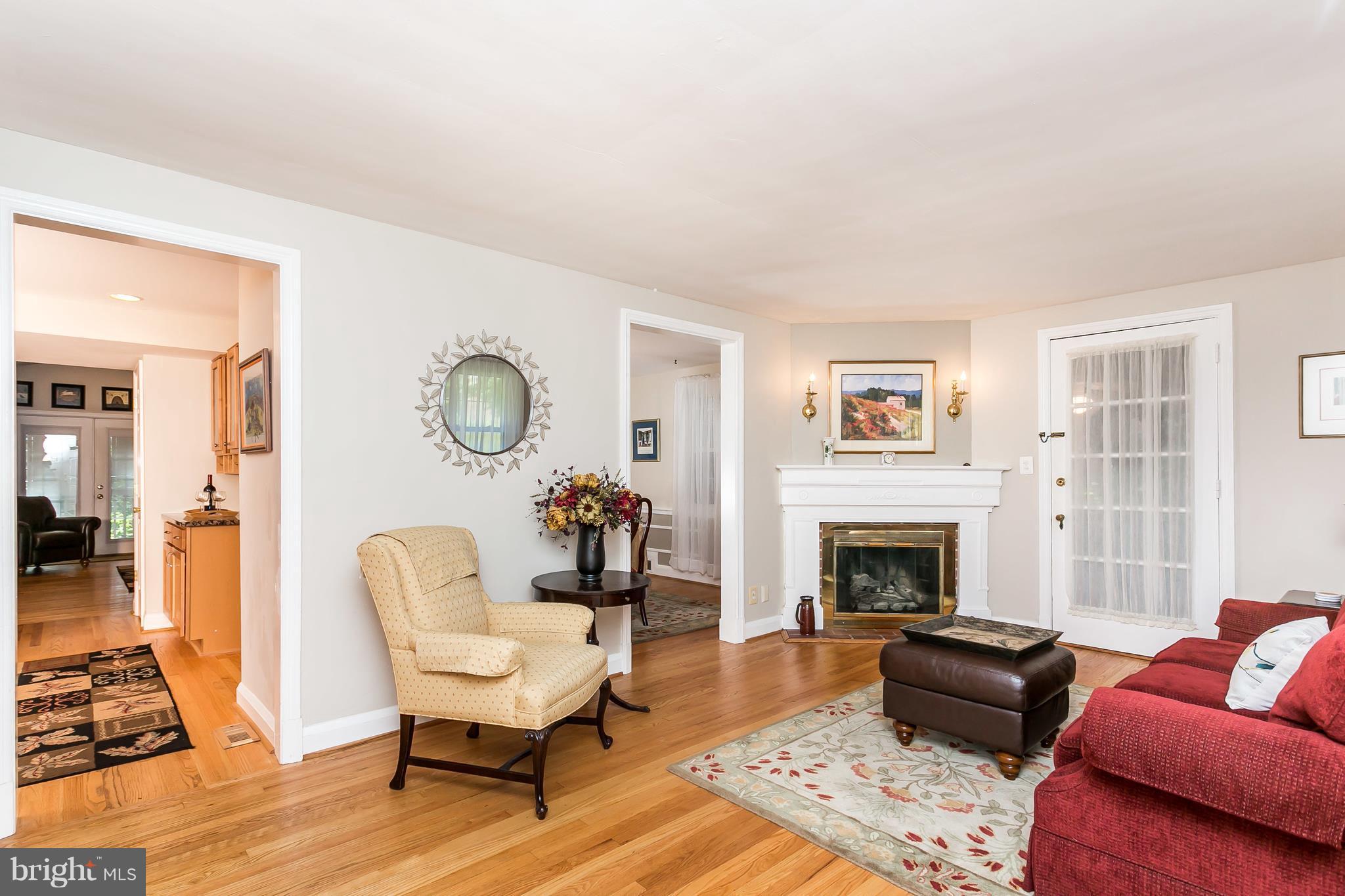 409 Alabama Road Towson, MD 21204 - Photo 5 of 29 Door next to fireplace leads to screened in porch!