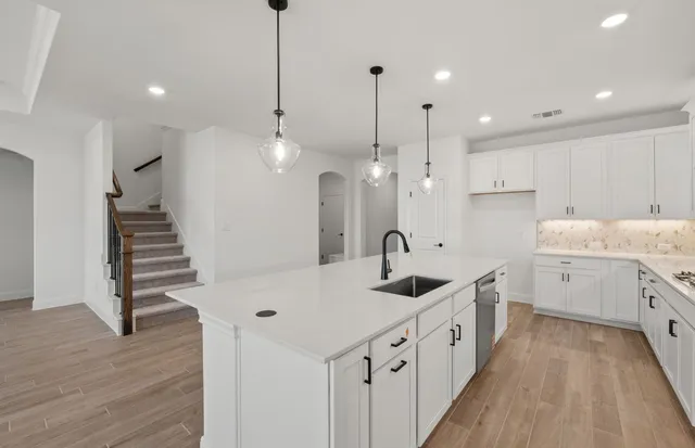 a picture of a bathroom with a sink and a picture of wall