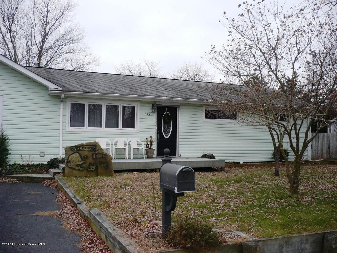 319 Stinson Road Brick, NJ 08723 - Photo 1 of 11 a front view of a house with garden