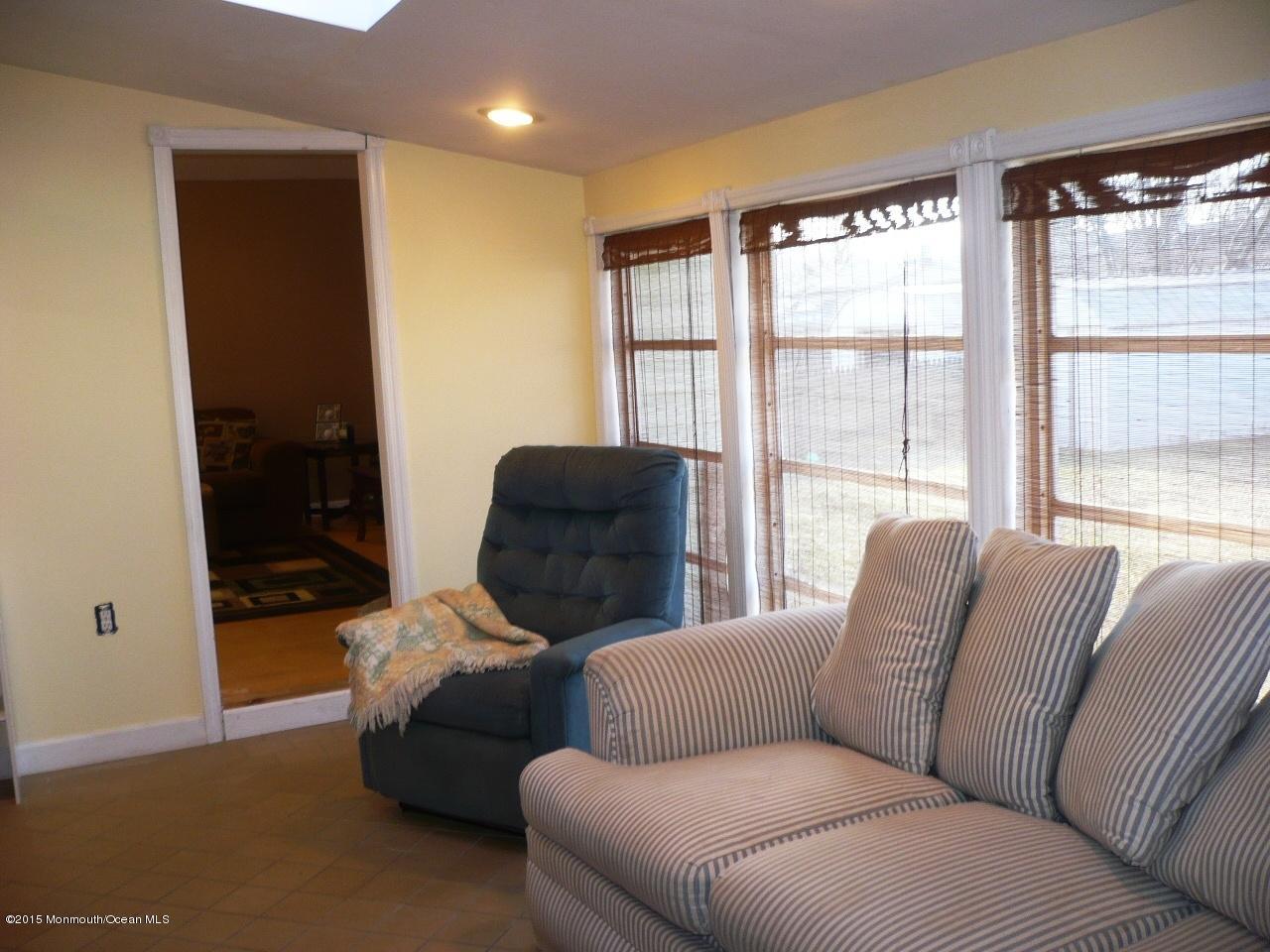 319 Stinson Road Brick, NJ 08723 - Photo 5 of 11 a living room with furniture and a window