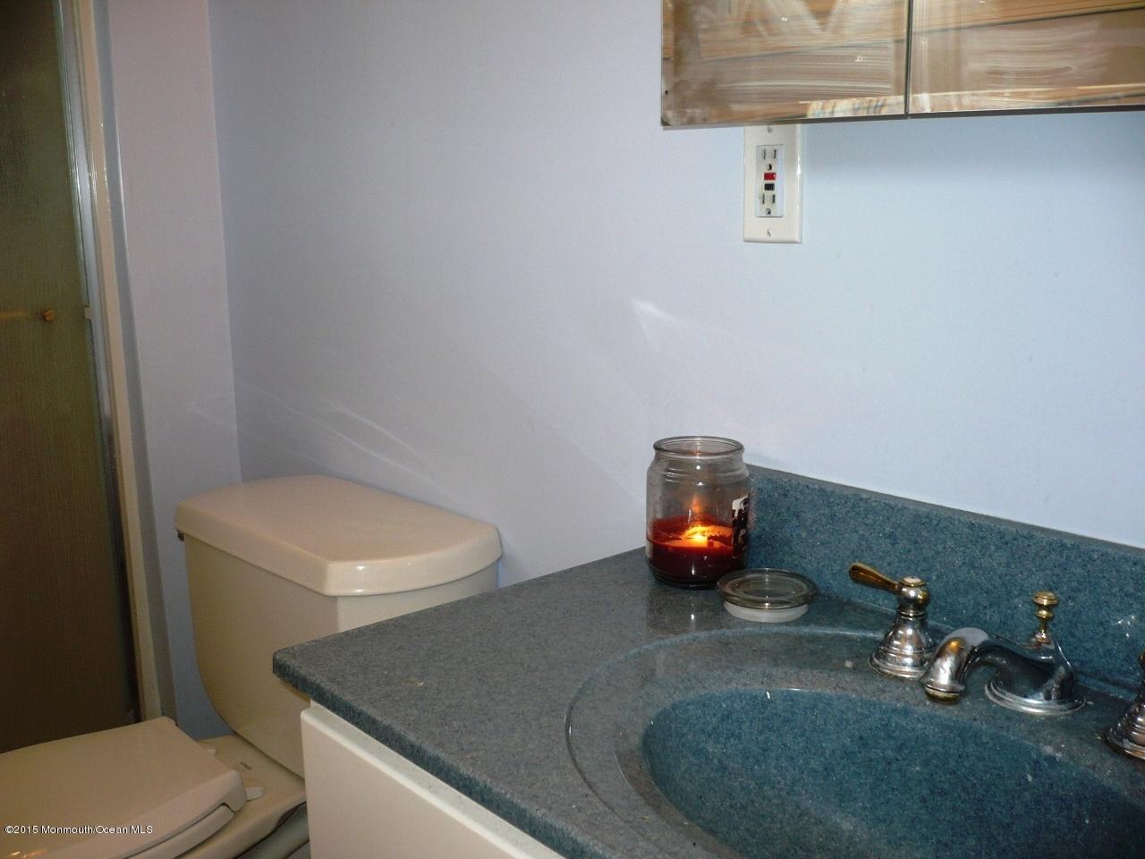 319 Stinson Road Brick, NJ 08723 - Photo 6 of 11 closeup of a bathroom with a sink and a toilet