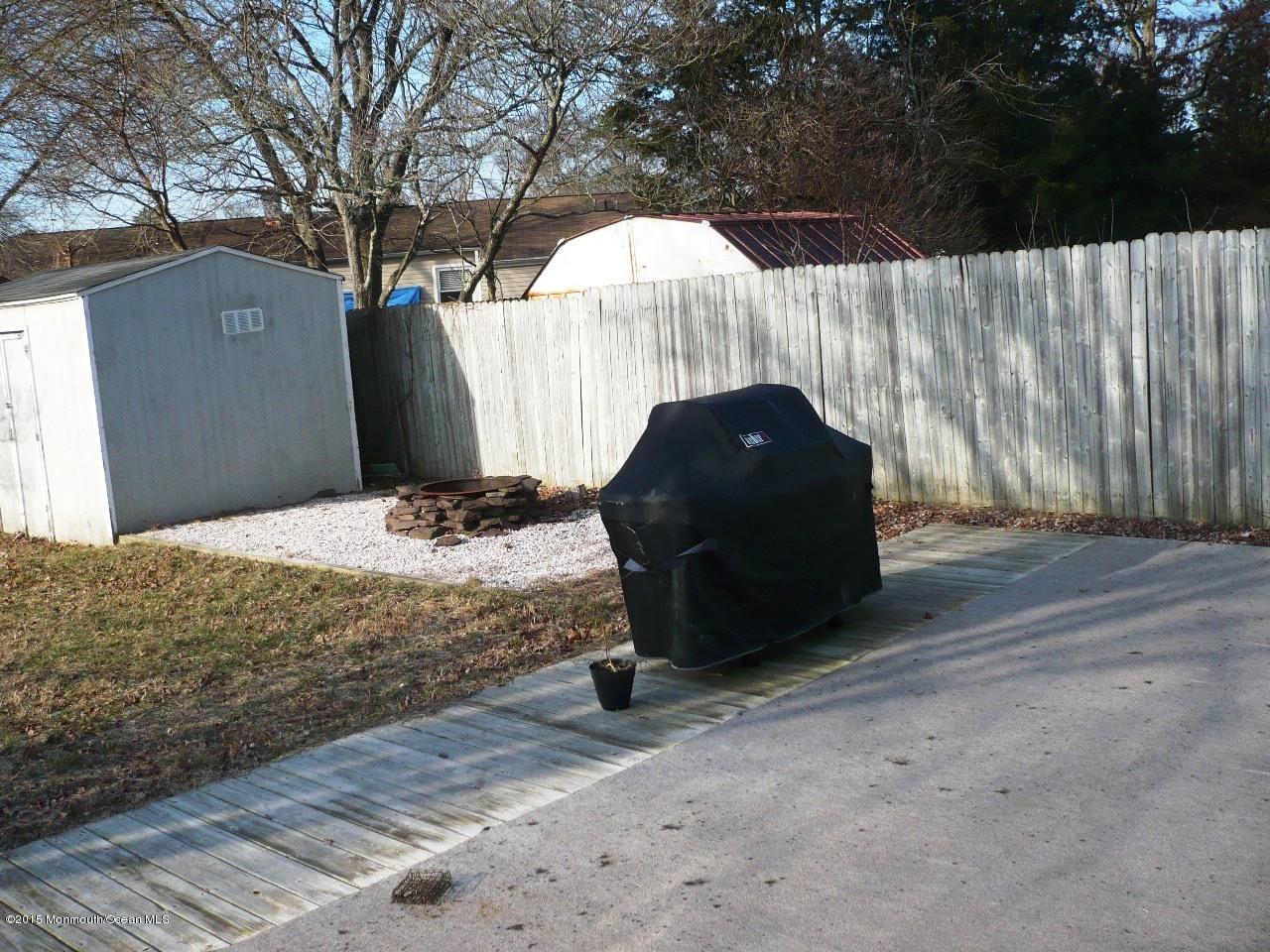 319 Stinson Road Brick, NJ 08723 - Photo 9 of 11 a view of a backyard