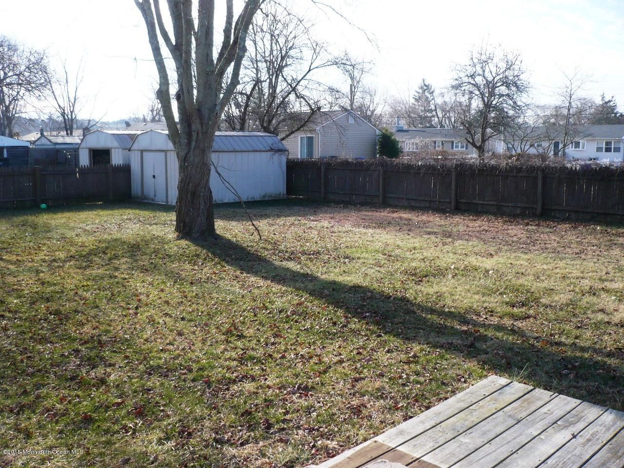319 Stinson Road Brick, NJ 08723 - Photo 10 of 11 a view of a yard with wooden fence