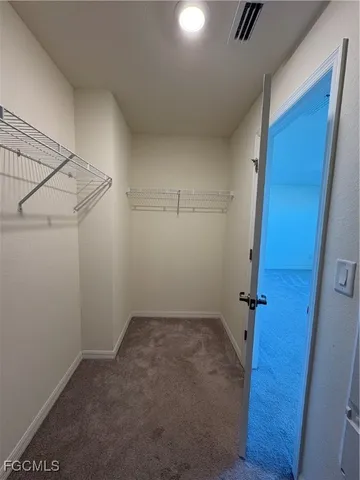 a view of a room with rack on the wall