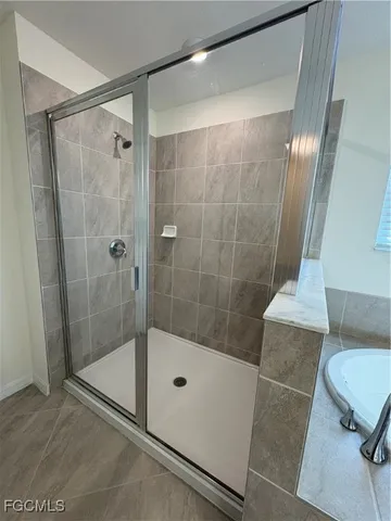 a bathroom with a shower and toilet