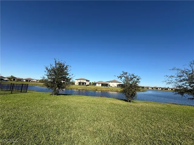 a view of a lake with a big yard